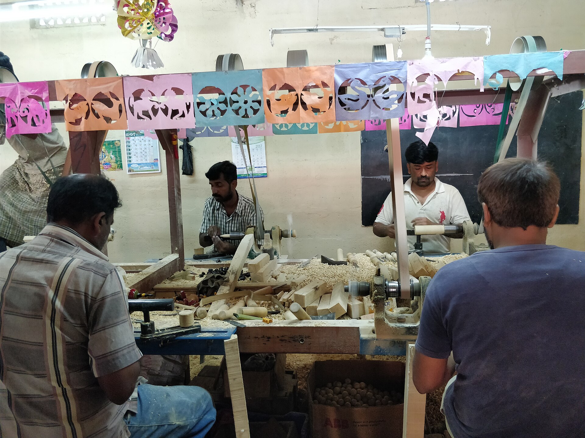 Channapatna artisan making lacquered wooden toys